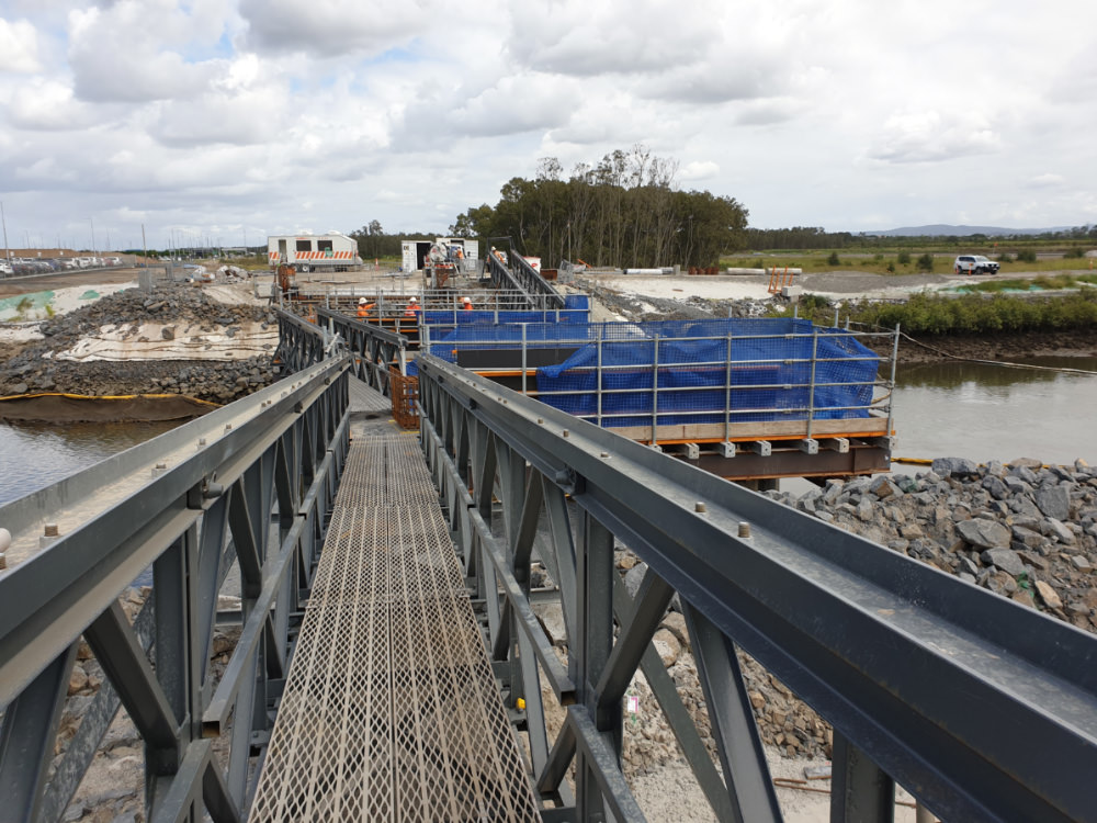 Construction of 3-span Kedron Brook Bridge with a cast insitu concrete substructure, precast deck unit superstructure and cast insitu deck